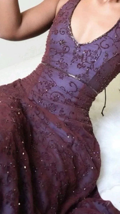 Detailed floral lace applique and texture on a deep purple formal prom dress