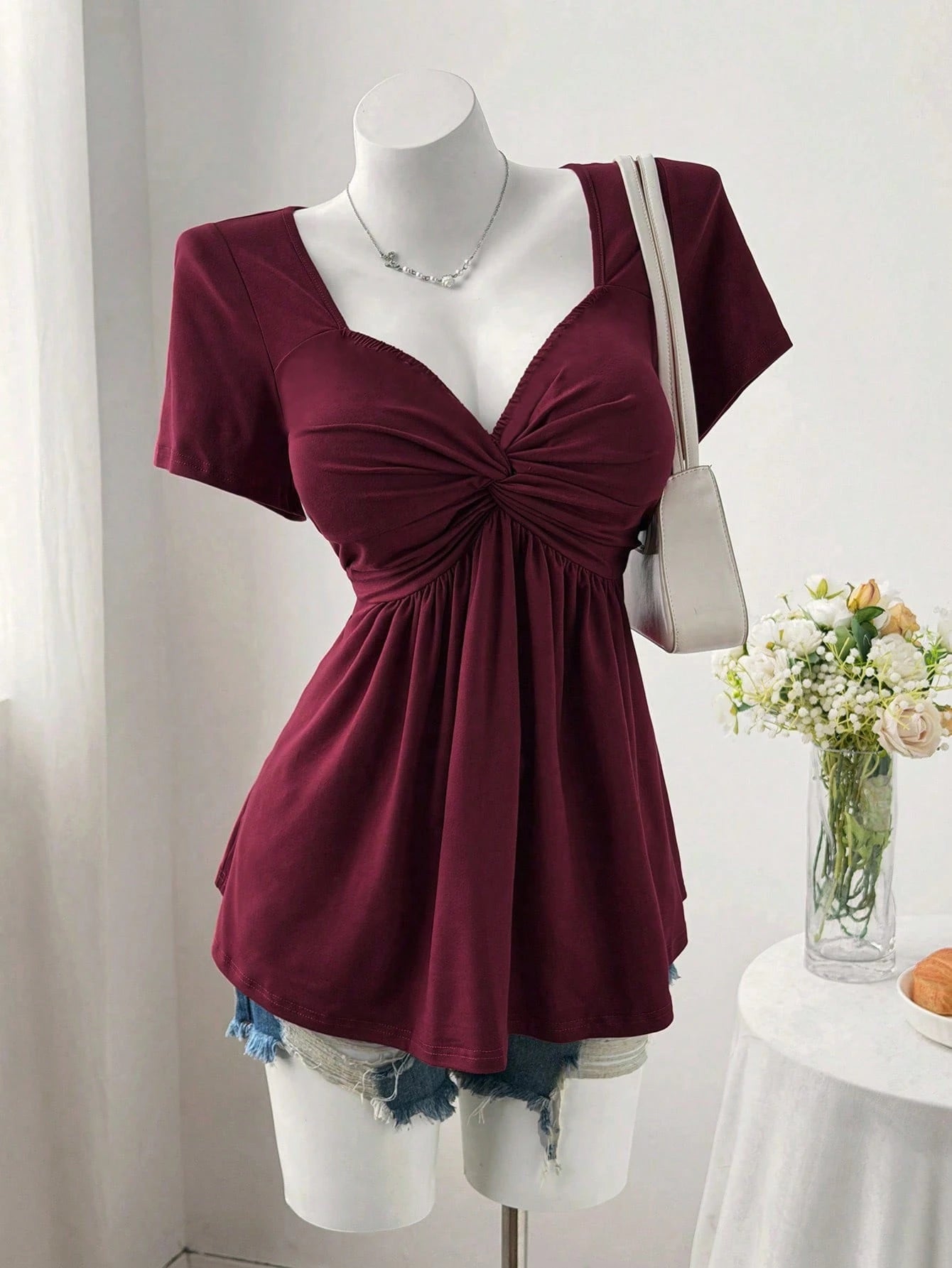 Sweetra Plus Size Women's Solid Color Twist Front Short Sleeve T-Shirt