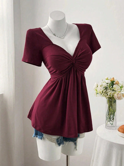 Sweetra Plus Size Women's Solid Color Twist Front Short Sleeve T-Shirt
