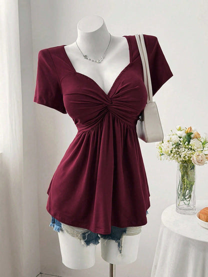 Sweetra Plus Size Women's Solid Color Twist Front Short Sleeve T-Shirt